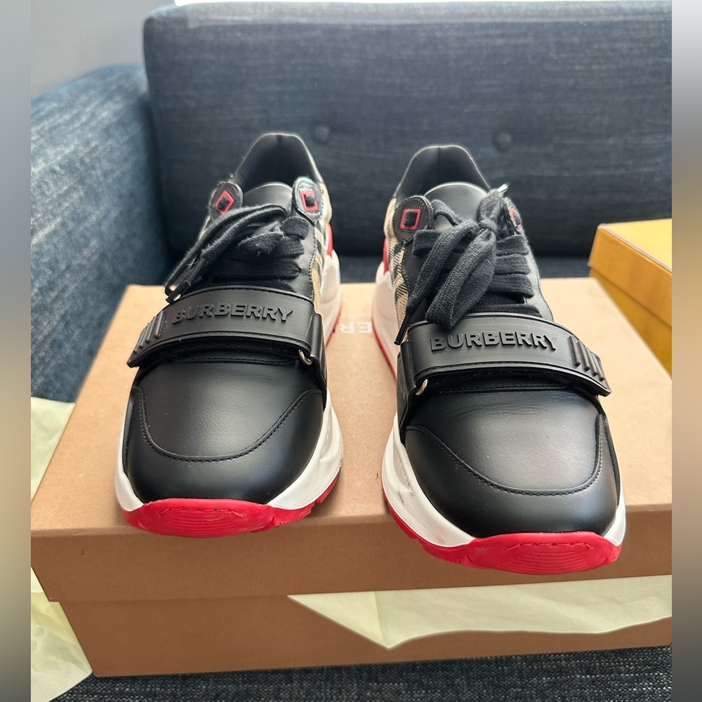 Burberry sneakers in black, red, and white.
